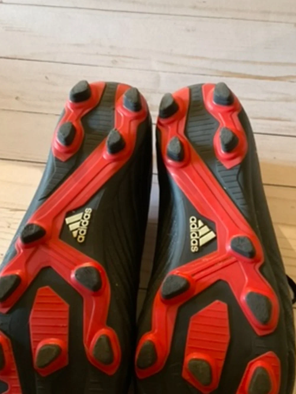 adidas Black Soccer Cleats with White Stripes and Red Interior